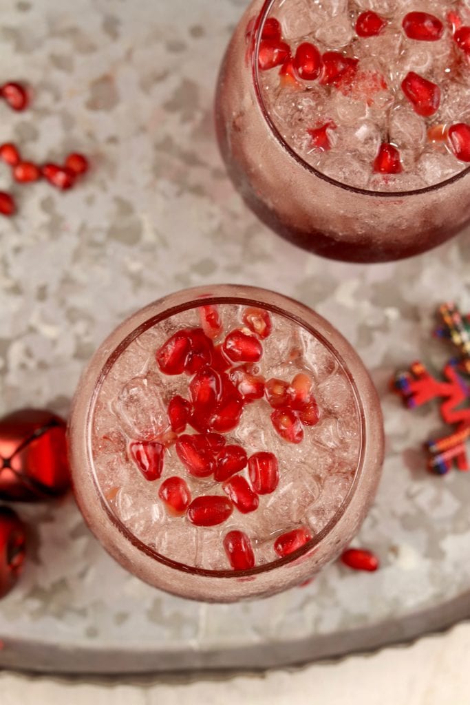 Overhead view of pomegranate mimosa cocktails with pomegranate arils