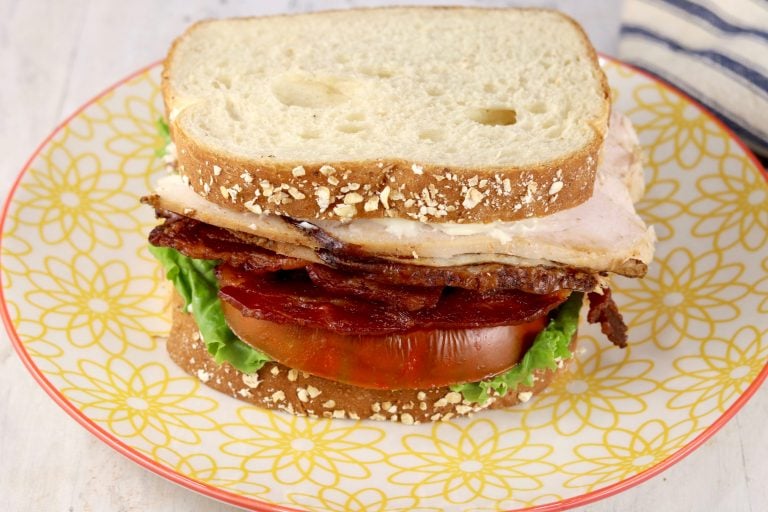 Turkey and bacon sandwich with lettuce and tomato