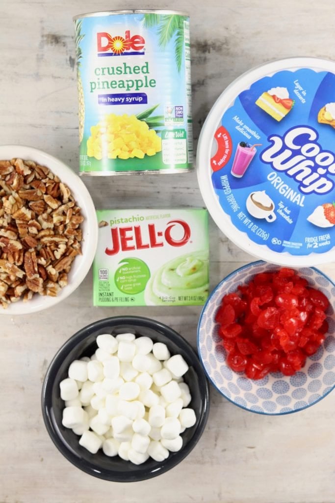 Ingredients for Watergate Salad: pecans, crushed pineapple, cool whip, cherries, mini marshmallows, pistachio pudding
