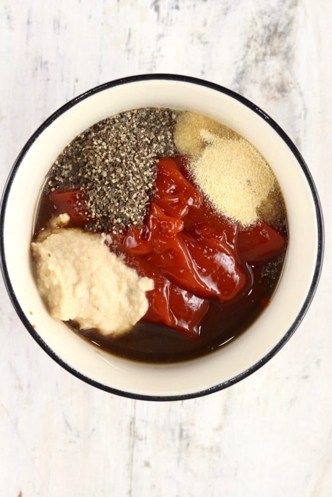 Bowl of ingredients for cocktail sauce - ketchup, horseradish, seasonings