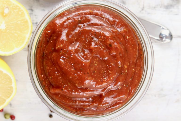Bowl of cocktail sauce with lemon slices