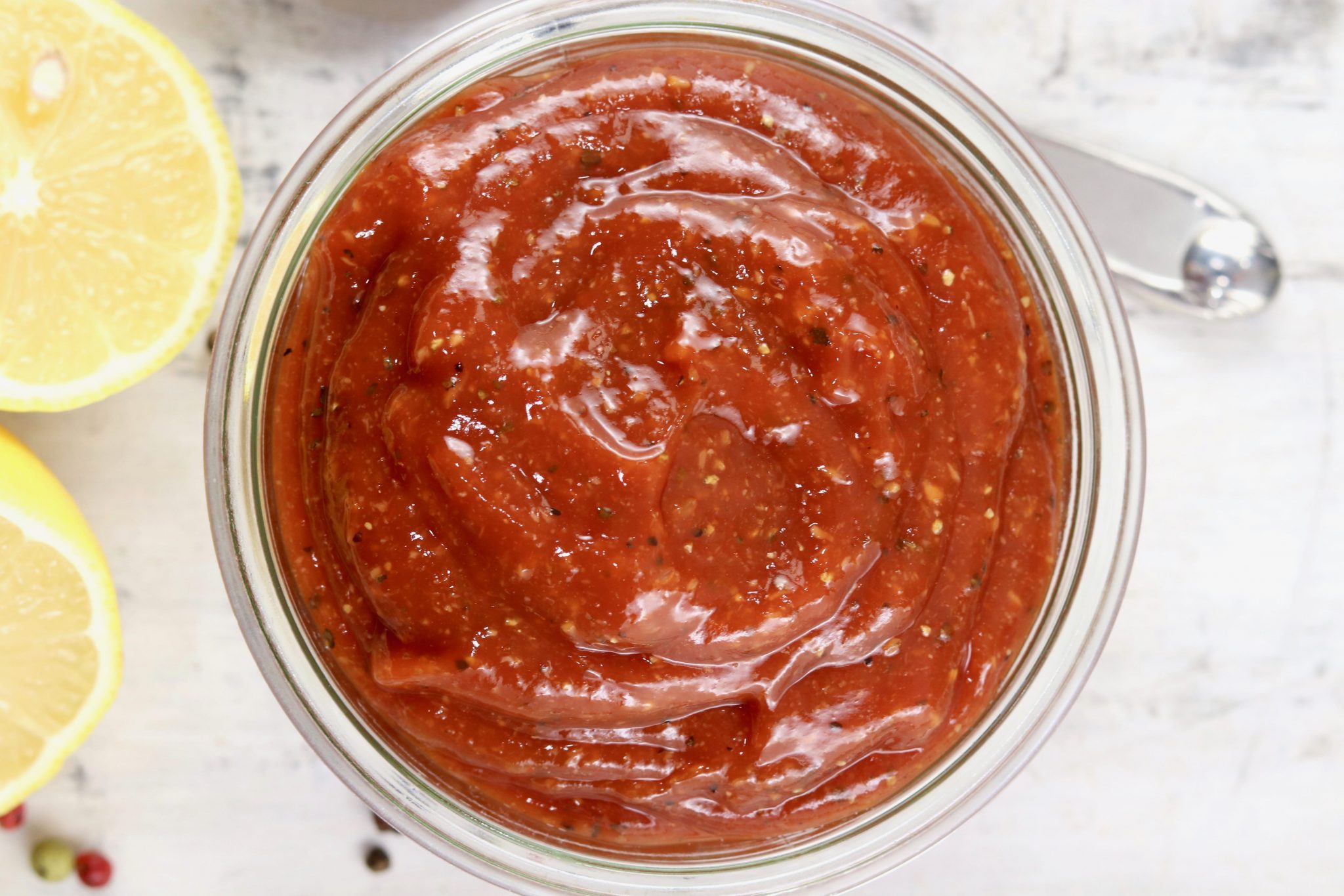 Bowl of cocktail sauce with lemon slices