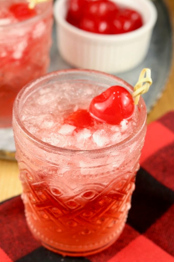 Cranberry Old Fashioned Cocktail on a buffalo plaid napkin
