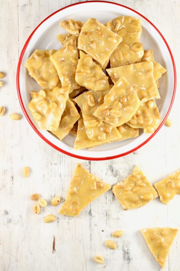 Homemade peanut brittle in a bowl