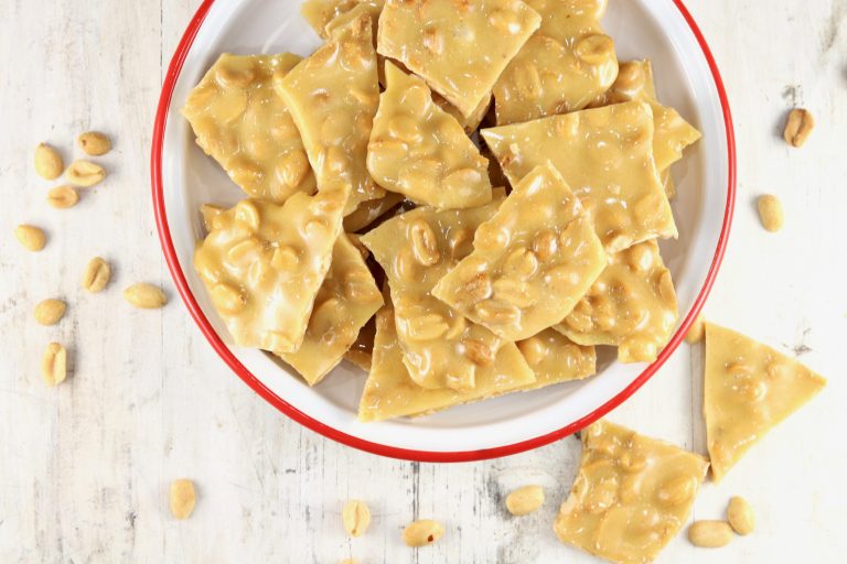 Peanut Brittle in a red rimmed bowl