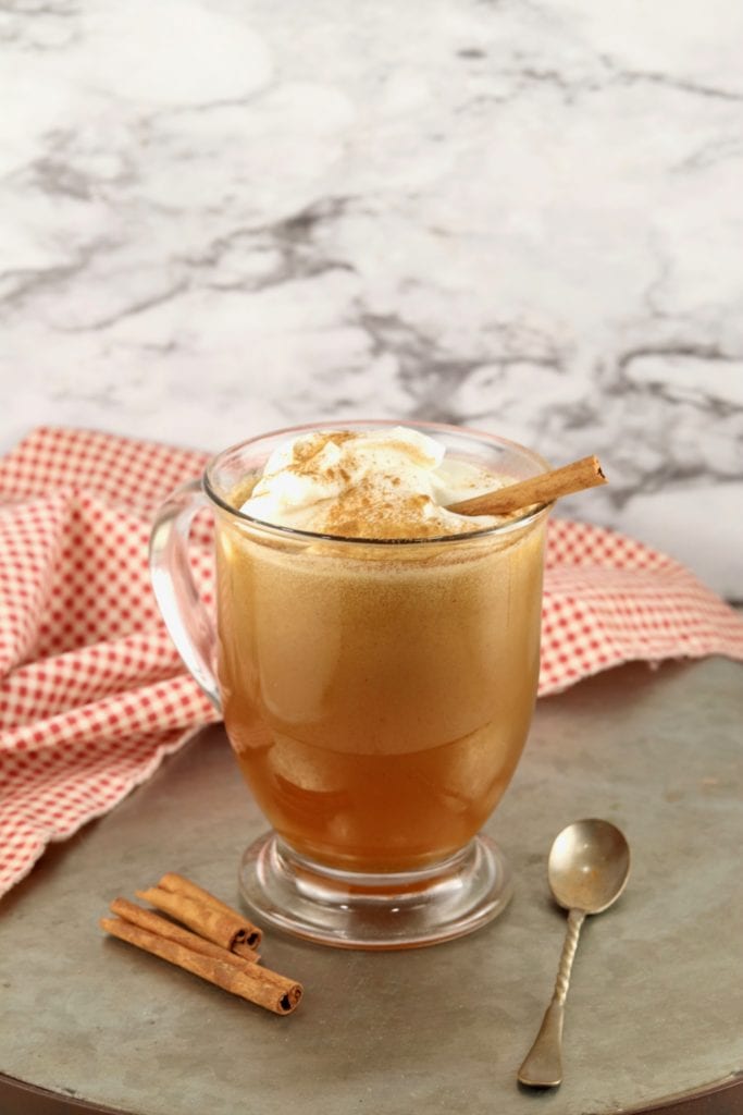 Clear mug of cider based buttered rum