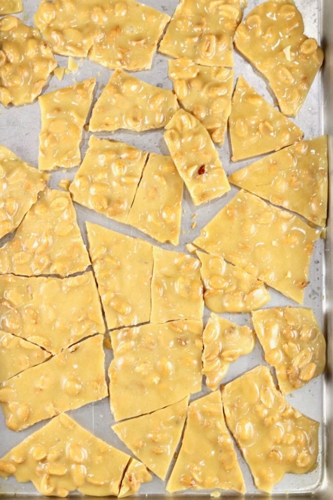 Peanut Brittle Candy broken into pieces on a sheet pan