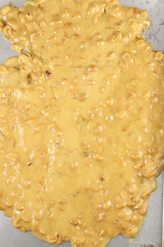 Baking sheet with peanut brittle waiting to cool