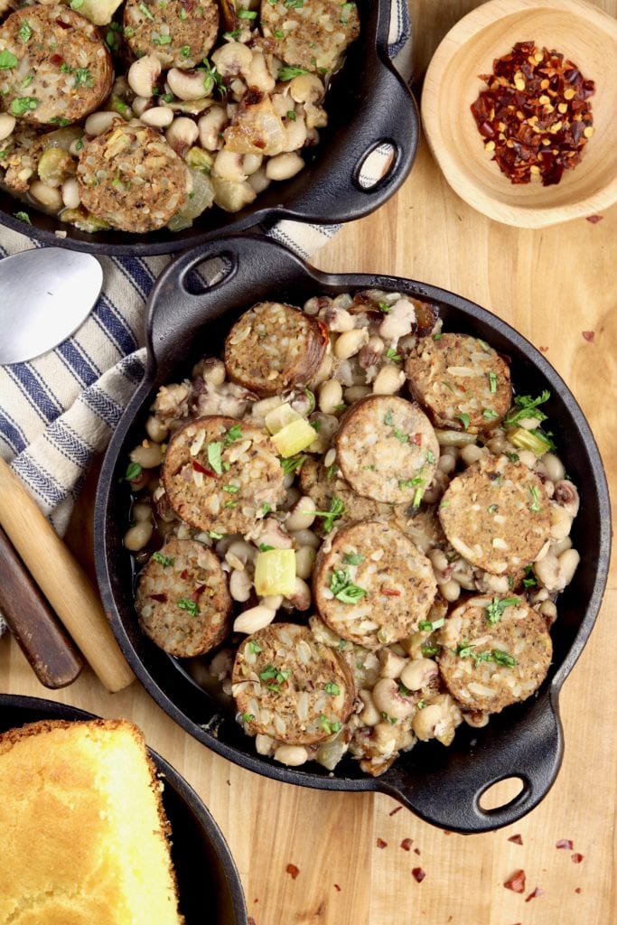Cast iron mini skillet with purple hull peas and boudin sausage