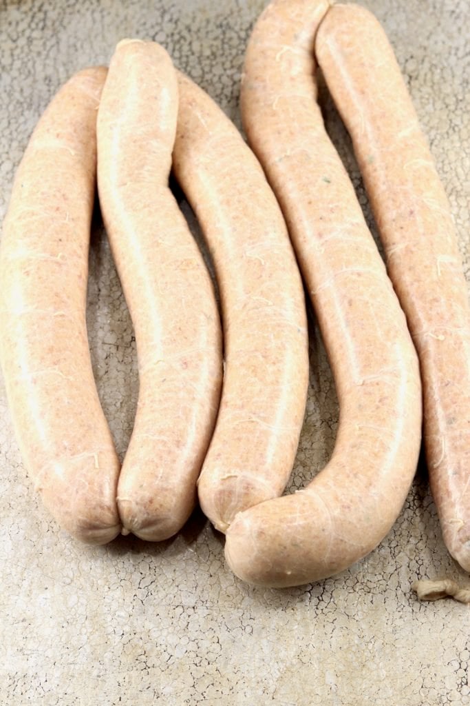 Andouille Sausage links on a sheet pan before smoking