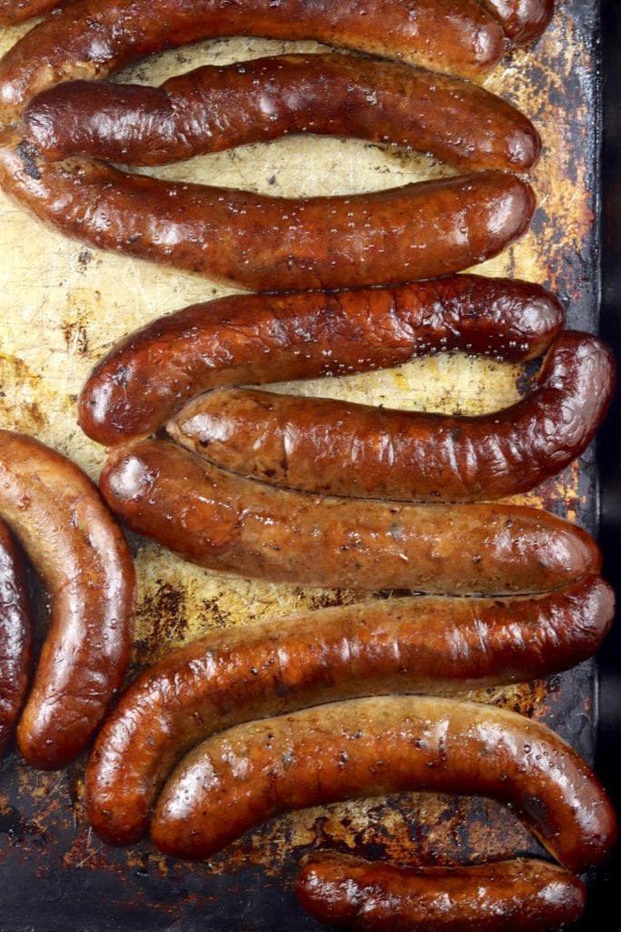 Smoked Cajun sausage on a sheet pan