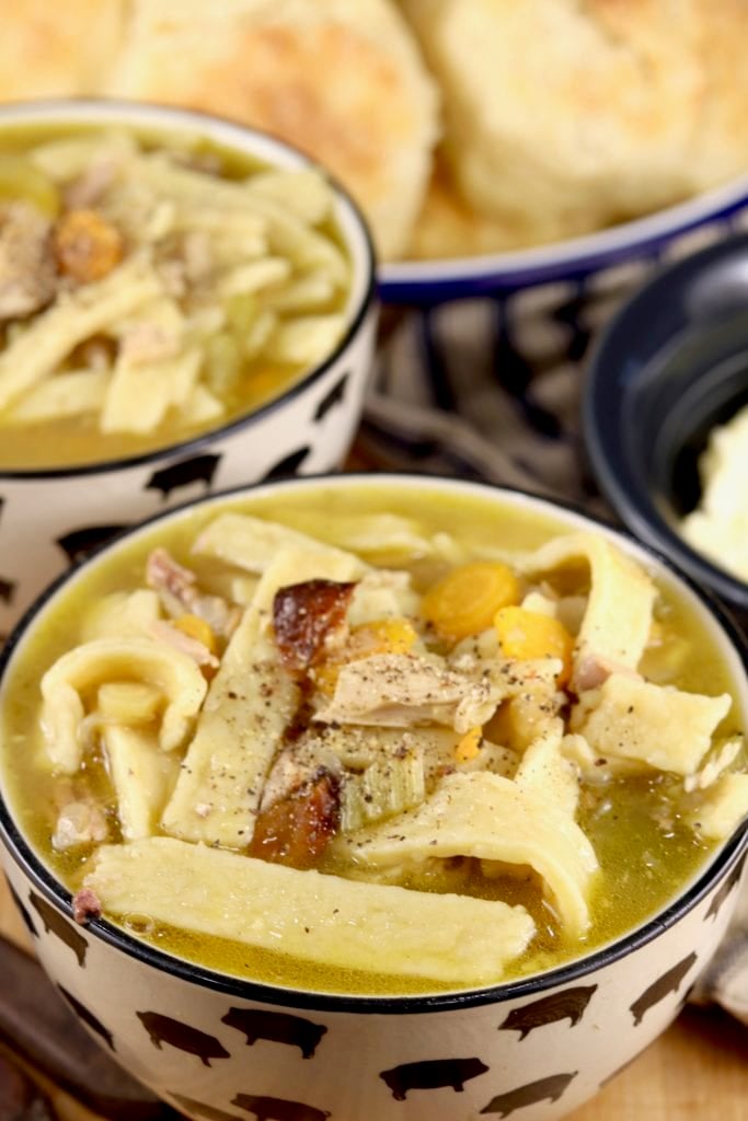 Bowl of homemade noodle soup with smoked chicken