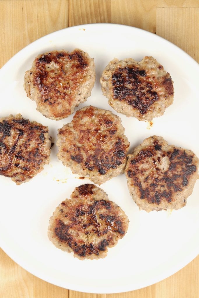 Cooked Sausage Patties on a white plate