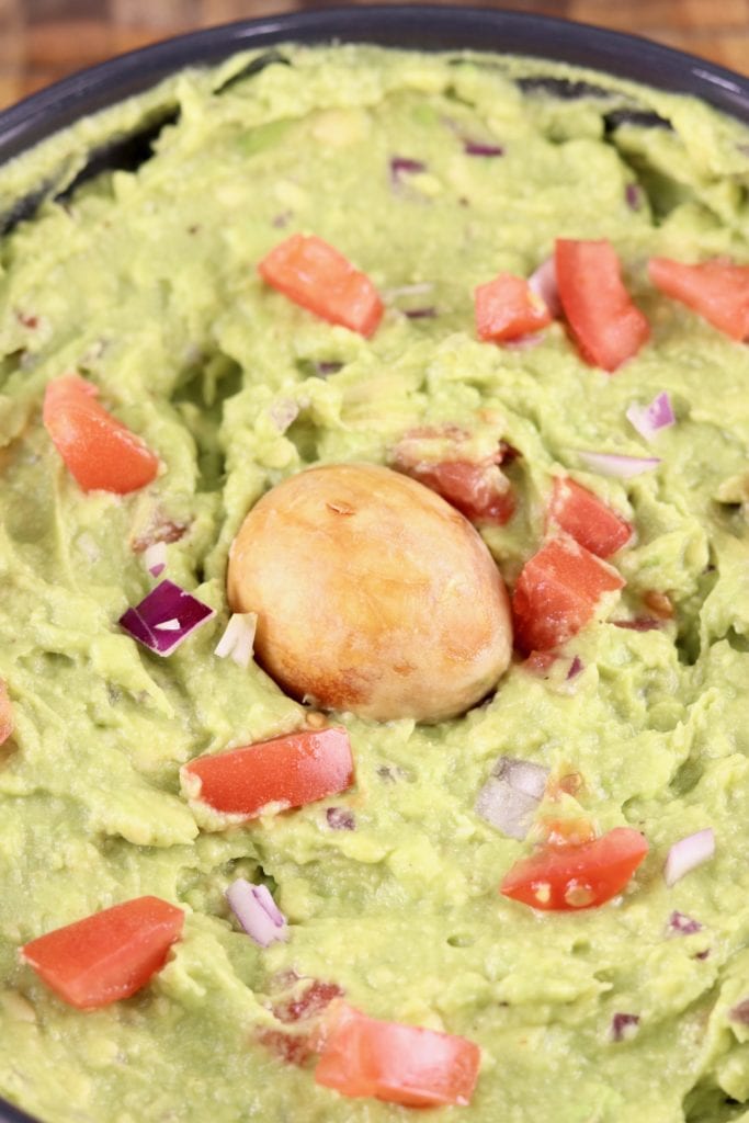 Guacamole with avocado seed in center 