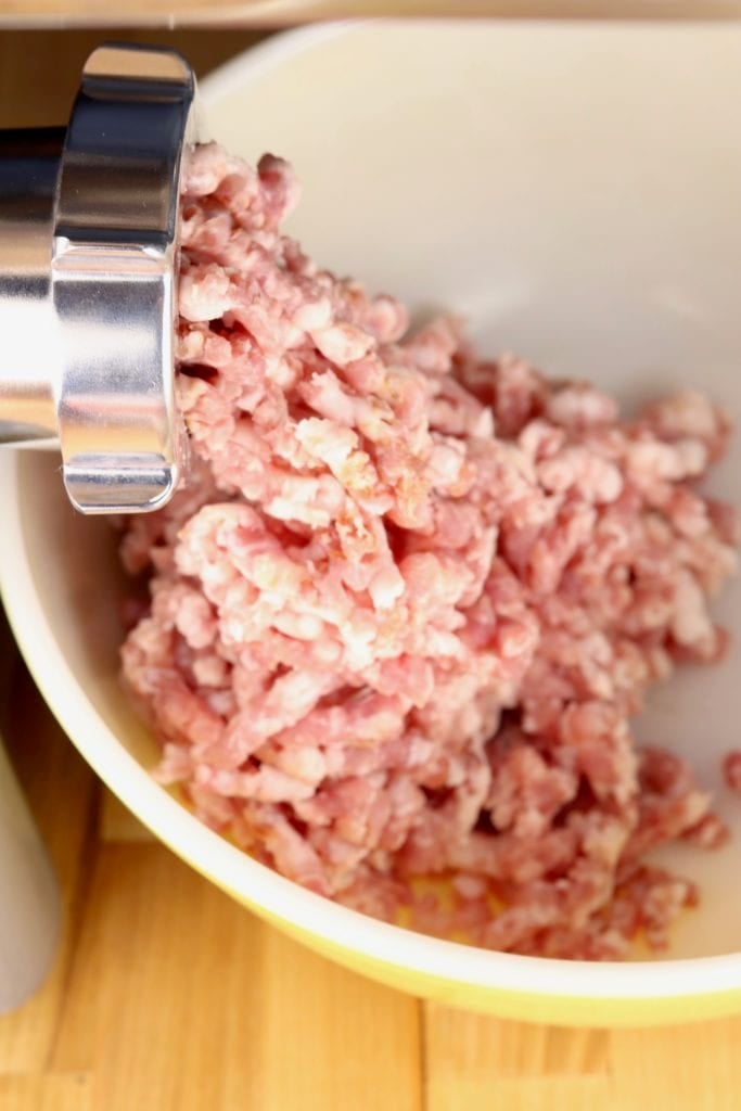 Grinding pork with a meat grinder