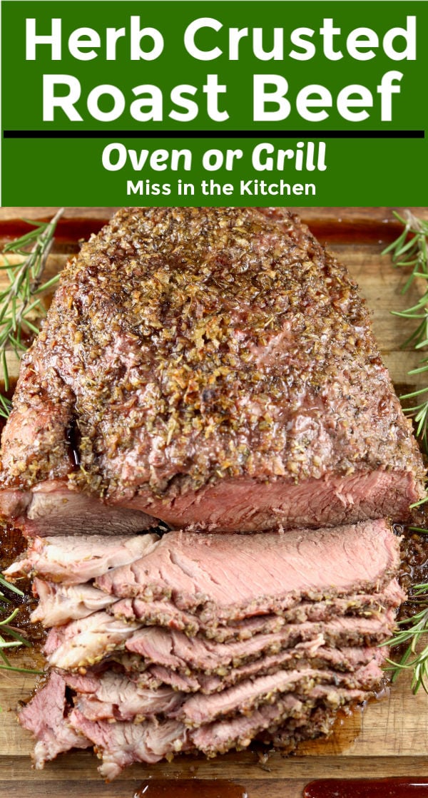 Herb Crusted Roast Beef - sliced on a cutting board