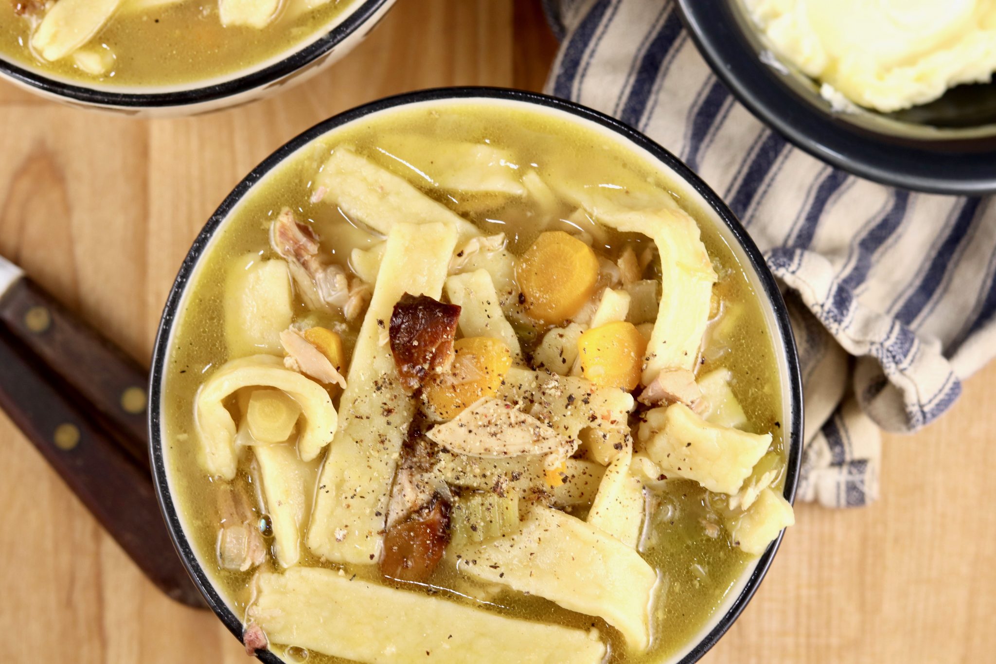 chicken noodle soup bowl with carrots