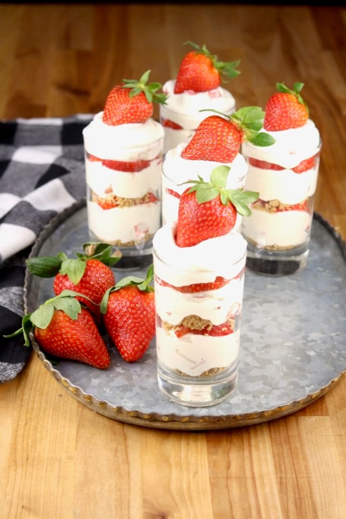 Layered strawberry cheesecake shooters