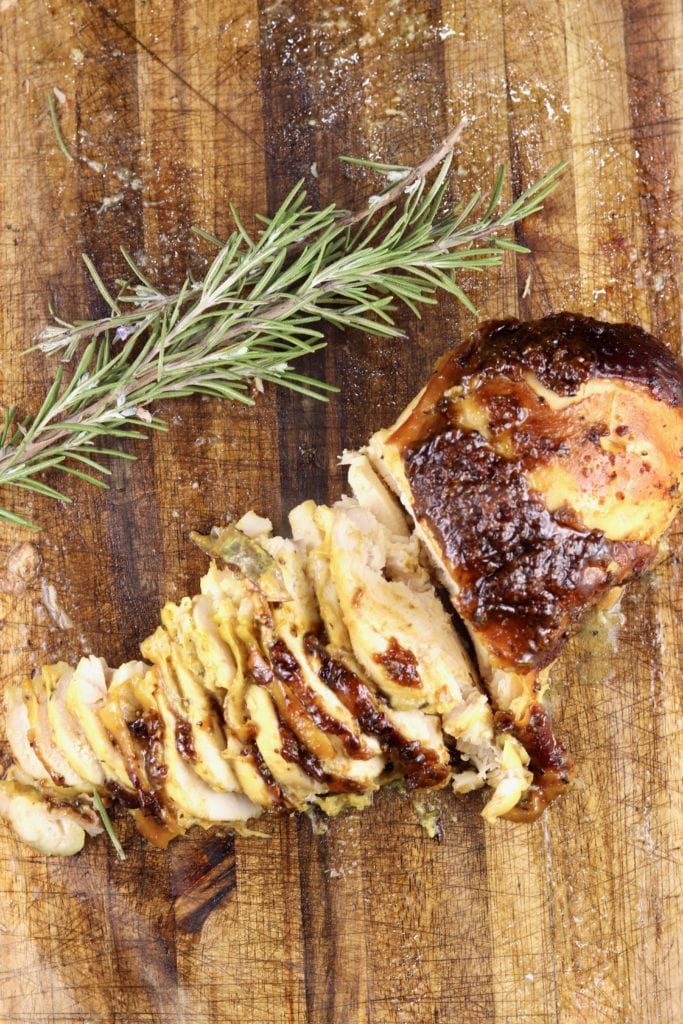 smoked chicken sliced on a board