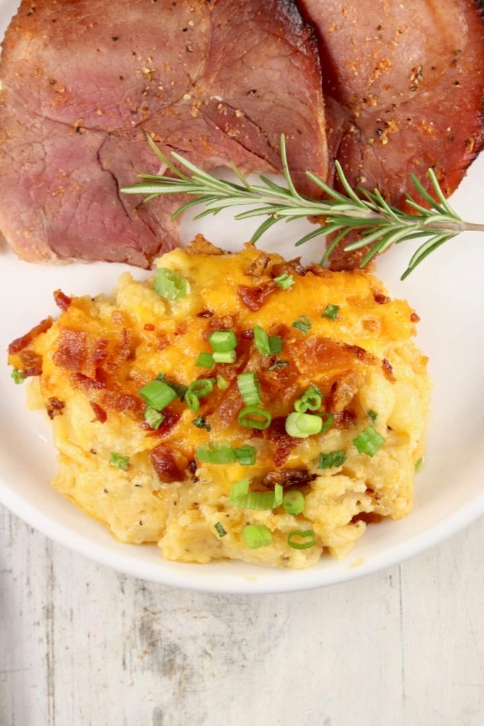 plate of sliced ham and potato casserole