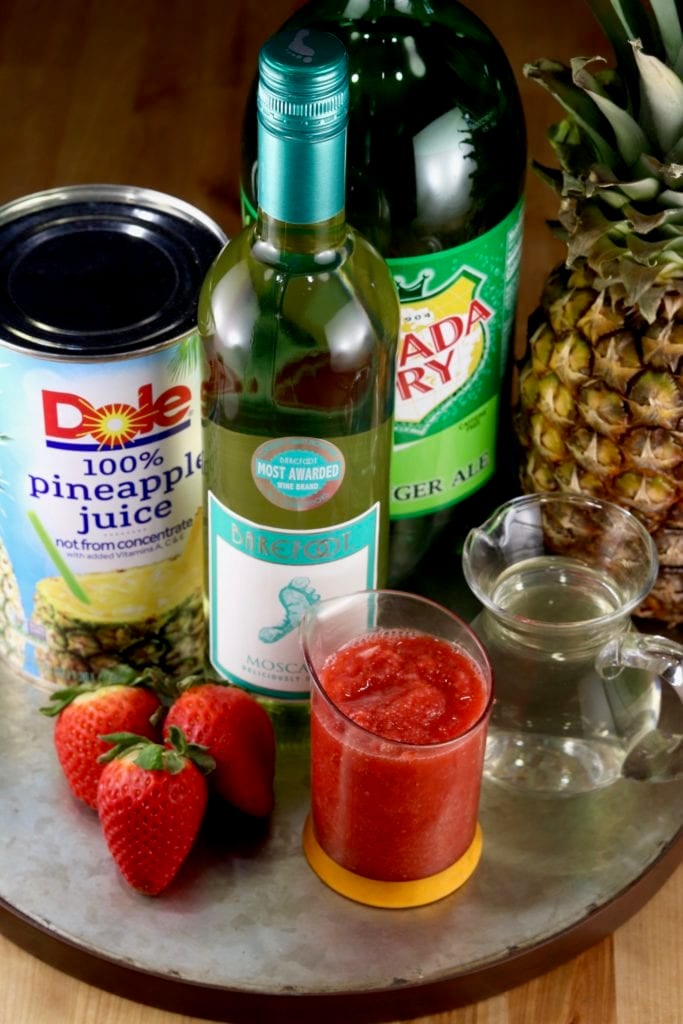 wine cocktail with strawberries, pineapple juice and ginger ale