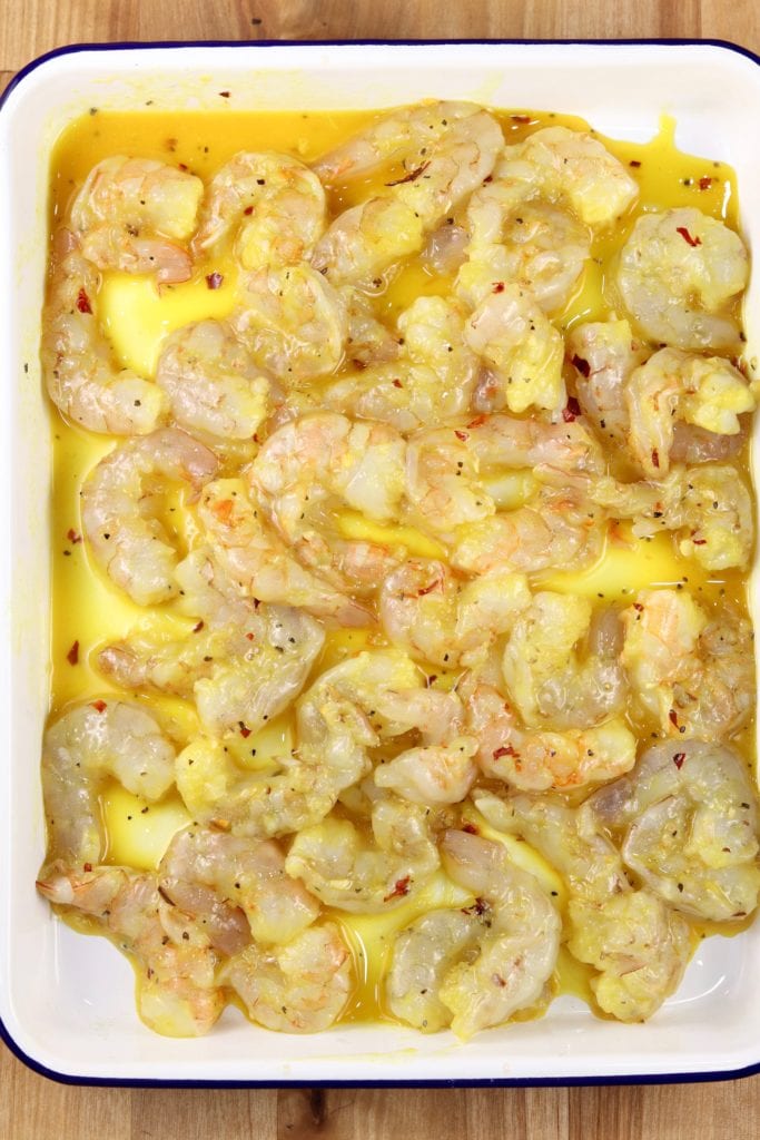 pan of large shrimp marinating in honey mustard