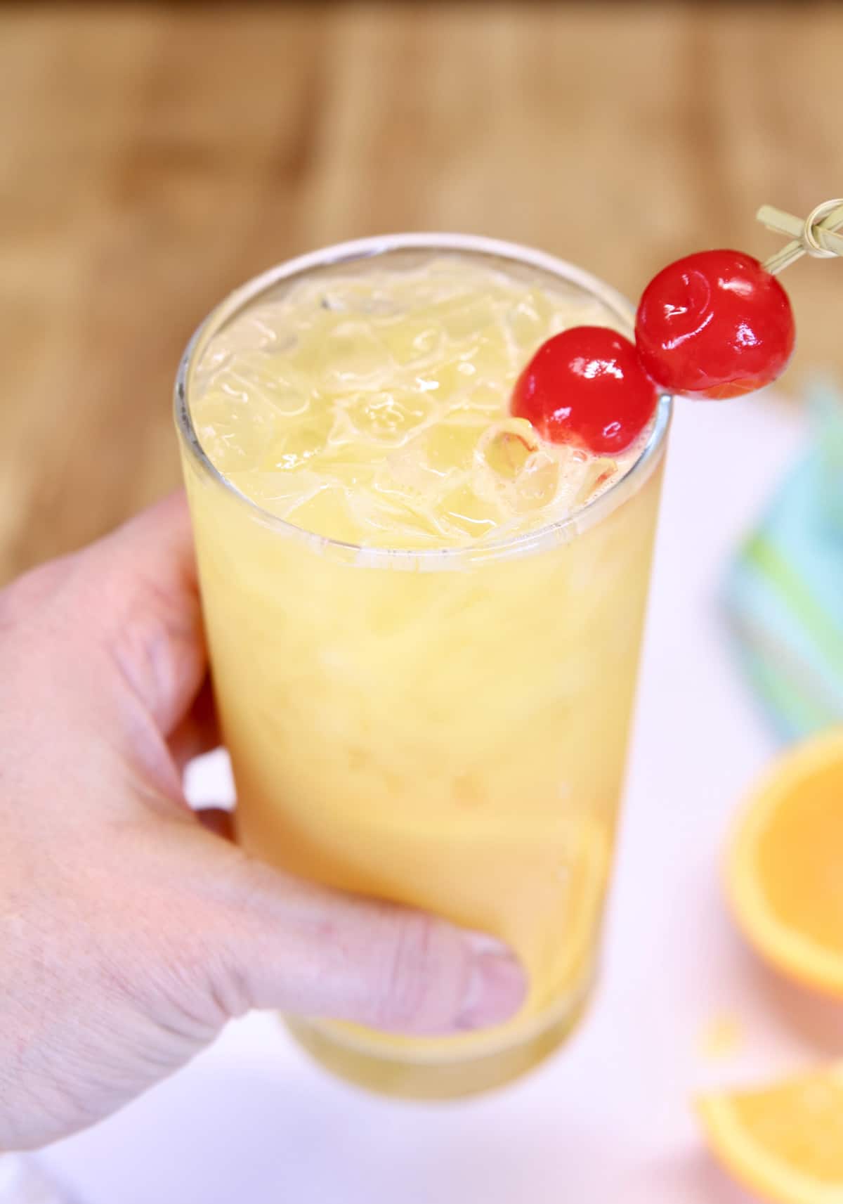 hand holding fuzzy screwdriver cocktail.