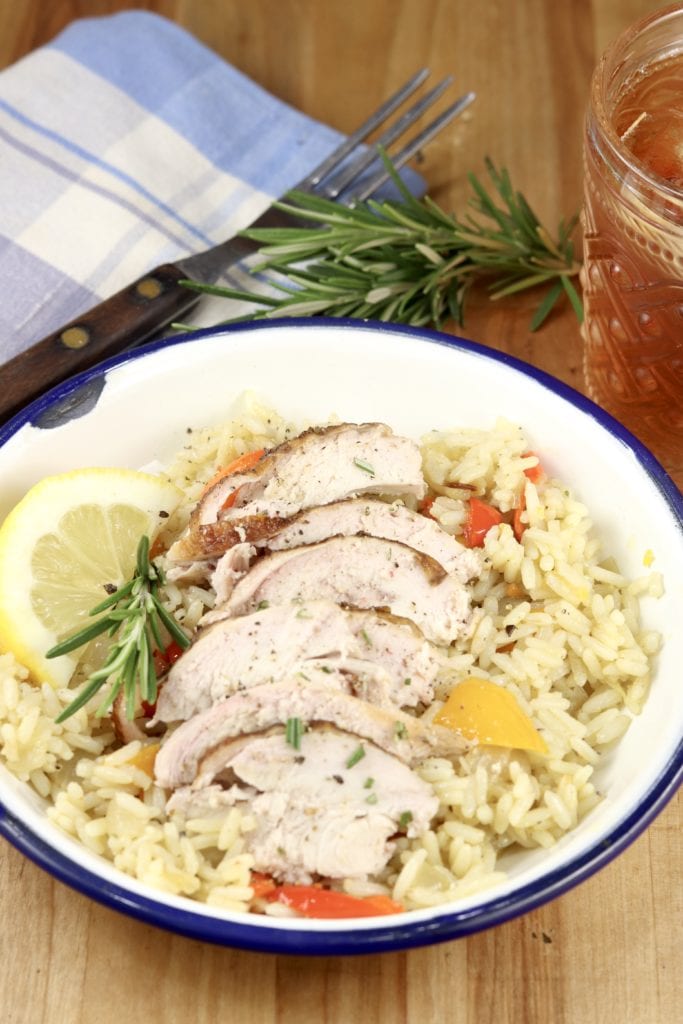 Sliced butter & herb chicken over rice pilaf