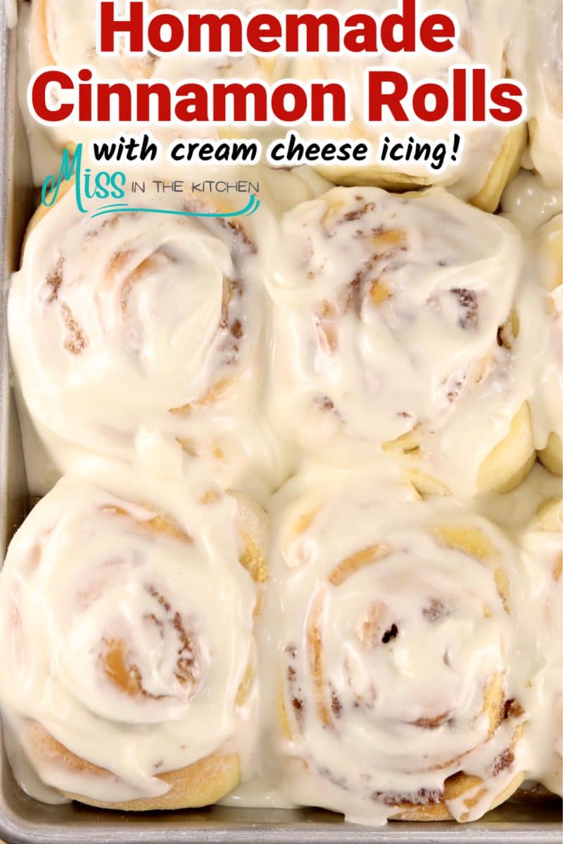 Pan of cinnamon rolls with cream cheese icing.