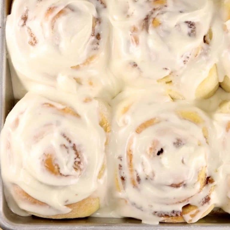 Homemade cinnamon rolls with cream cheese icing.