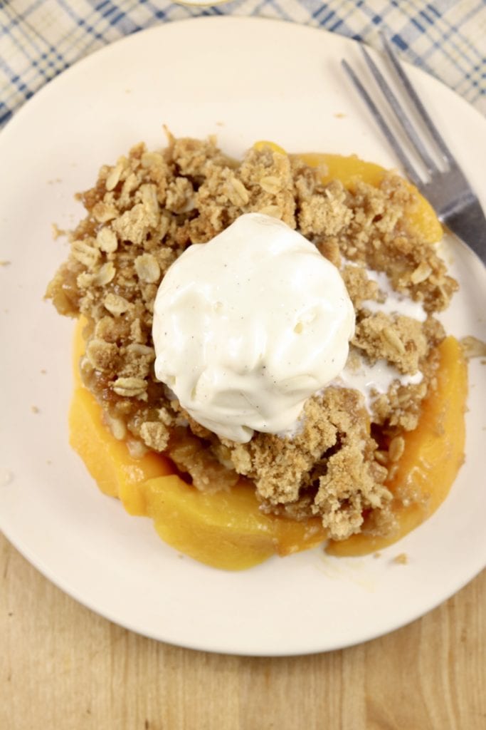 Peach crisp topped with ice cream