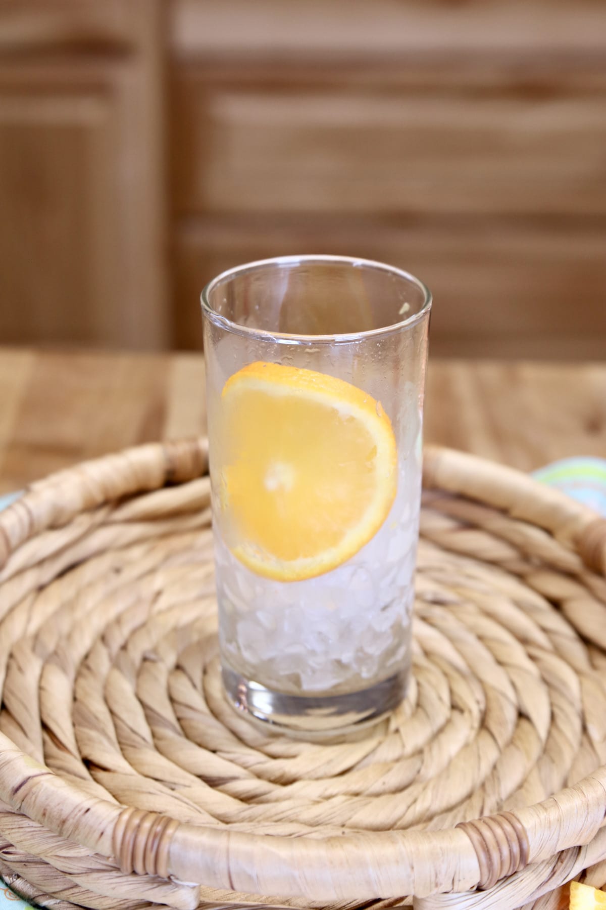 glass with ice and an orange slice.