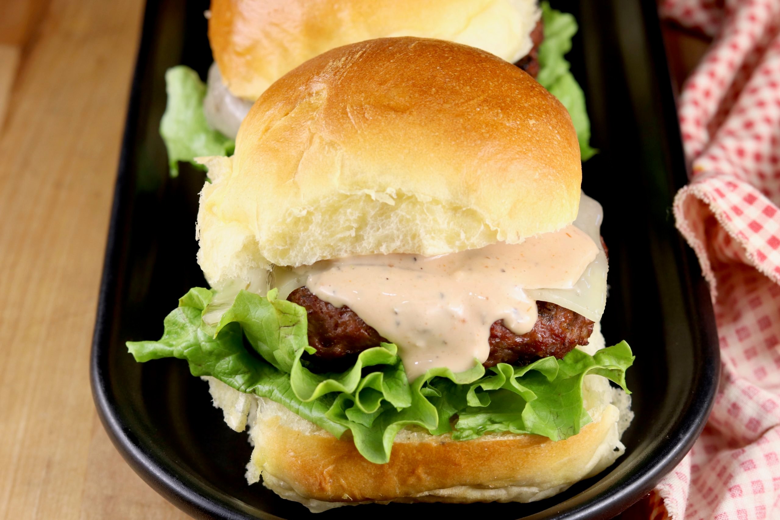Cheeseburger sliders with burger sauce.