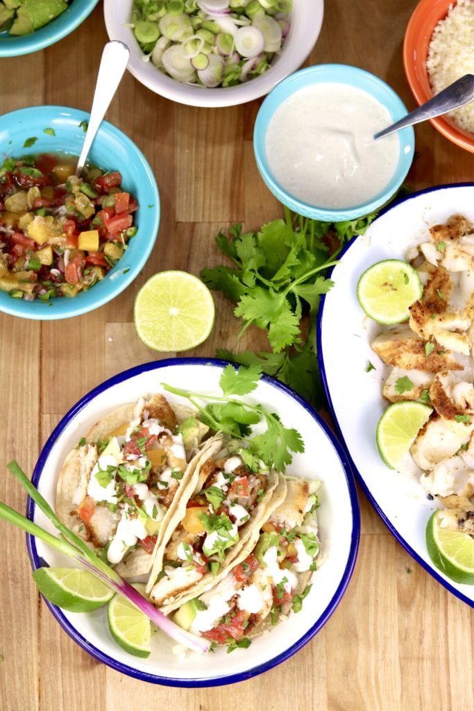 Grilled Fish Tacos with salsa, fish taco sauce and onions