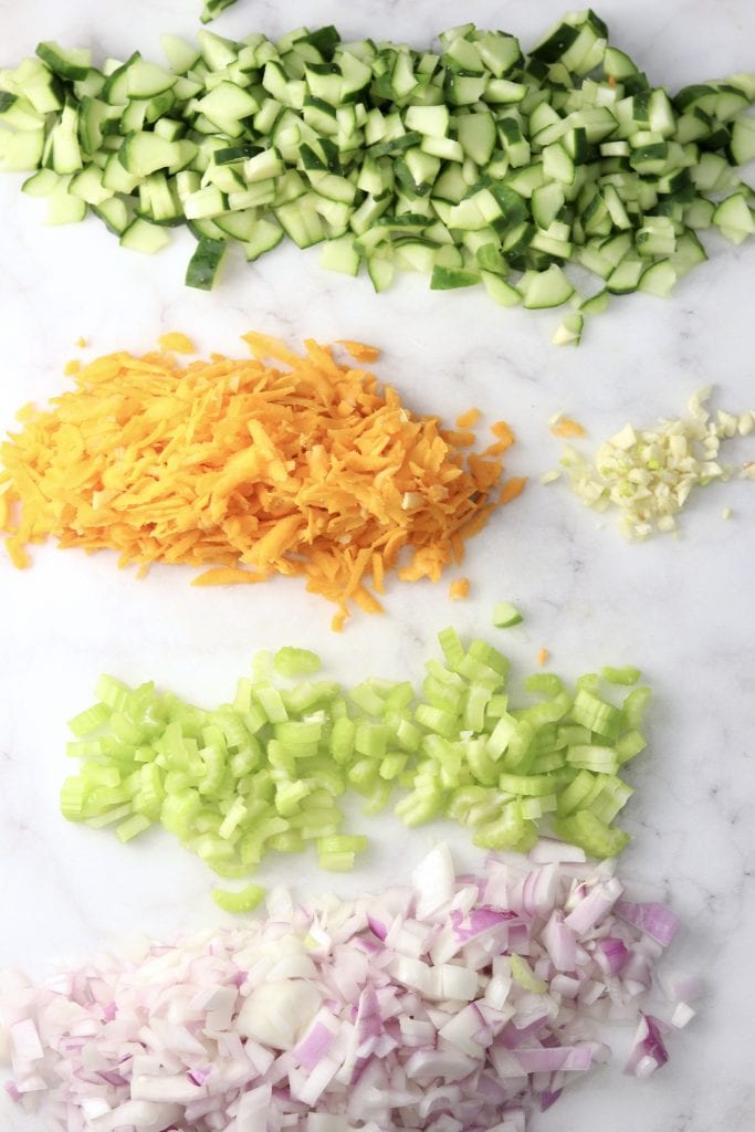 Chopped vegetables, cucumbers, carrots, garlic, celery and red onion
