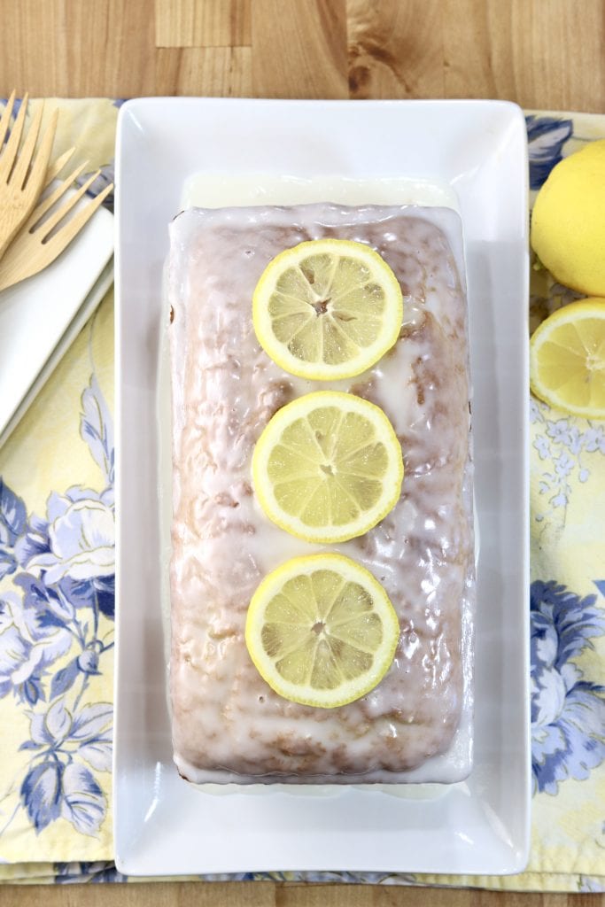 Glazed lemon zucchini cake with fresh lemon slices