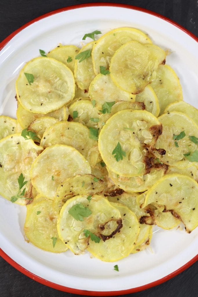 Parmesan Squash on a red rimmed white plate