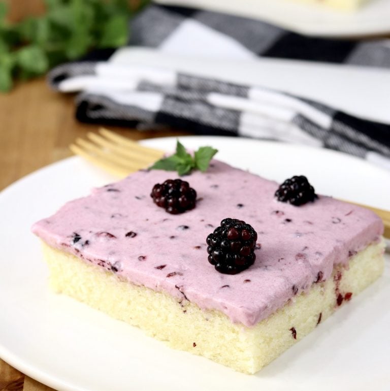 Slice of Blackberry Sheet Cake with fresh blackberry garnish