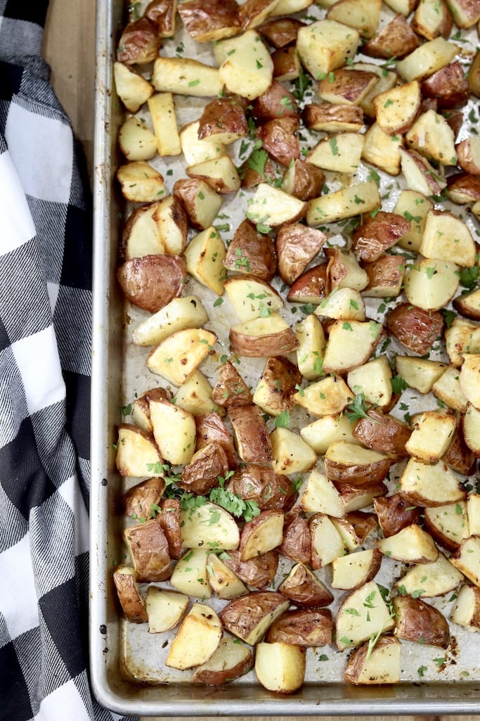 Ranch Roasted Potatoes on a sheet pan, black and white napkin to the side