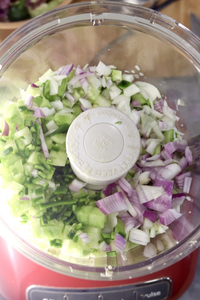 green tomatoes, onion, garlic and vinegar in a food processor