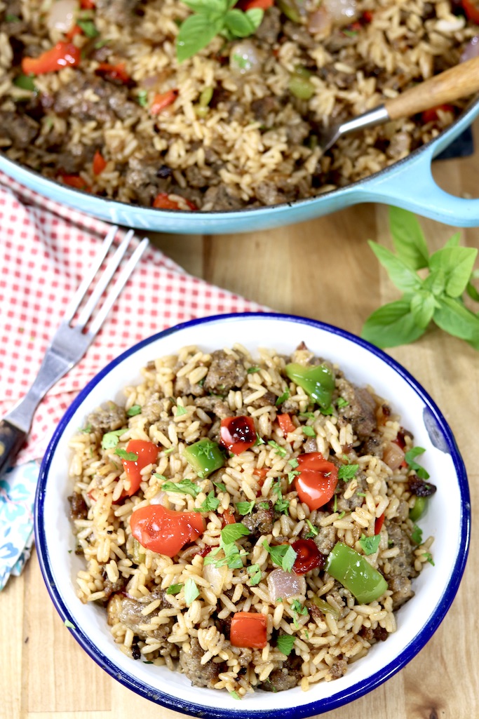 Skillet Rice with sausage and peppers, served in a white bowl