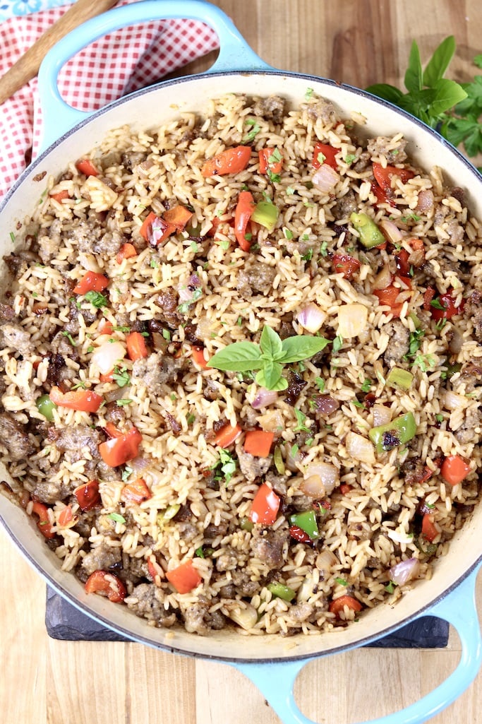 Sausage and Pepper Rice in a large skillet garnished with fresh basil