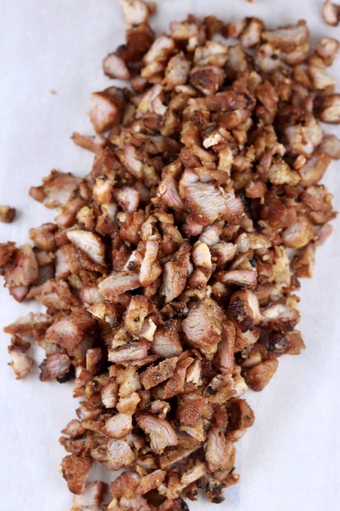 Diced smoked pork loin for chili on a piece of white parchment paper