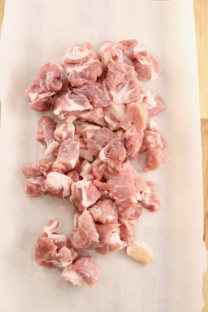 Cubed pork loin on white parchment paper