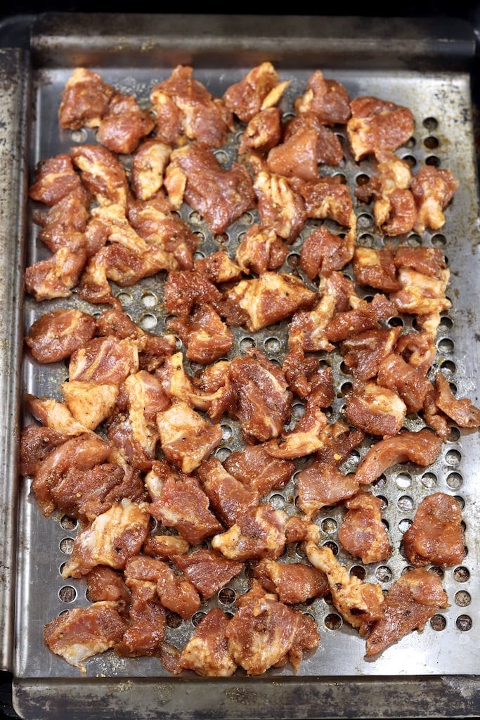 Dry rubbed cubes of pork on a grill pan
