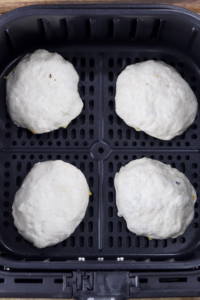 Air fryer basket with 4 breakfast biscuits