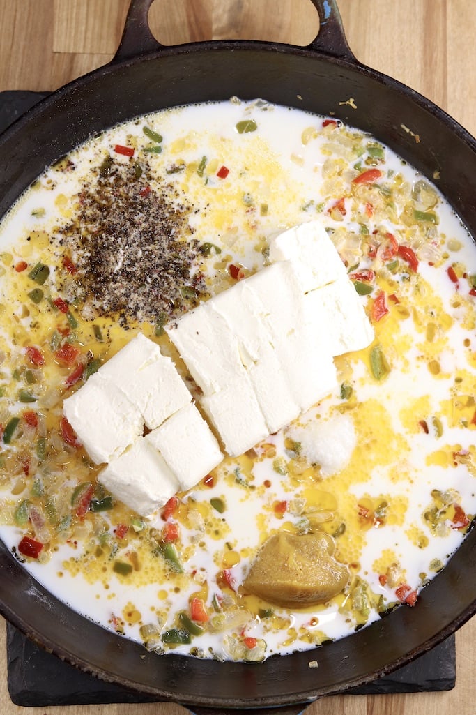making cheese sauce for chicken spaghetti with cream cheese, milk and chicken base