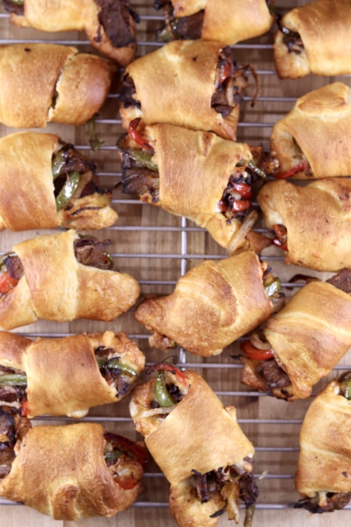 wire rack of cheesesteak rolls