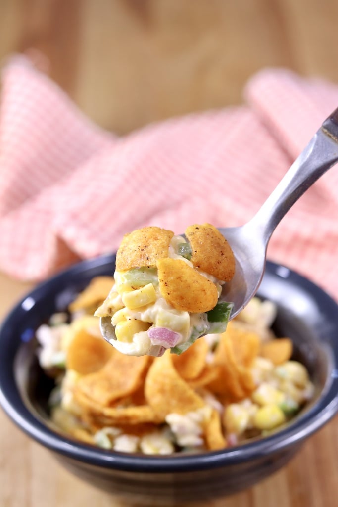 Chili Cheese Frito Corn Salad on a spoon - close view