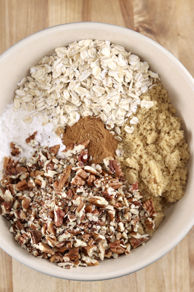 bowl with flour, pecans, brown sugar, oats, cinnamon for pumpkin crisp 